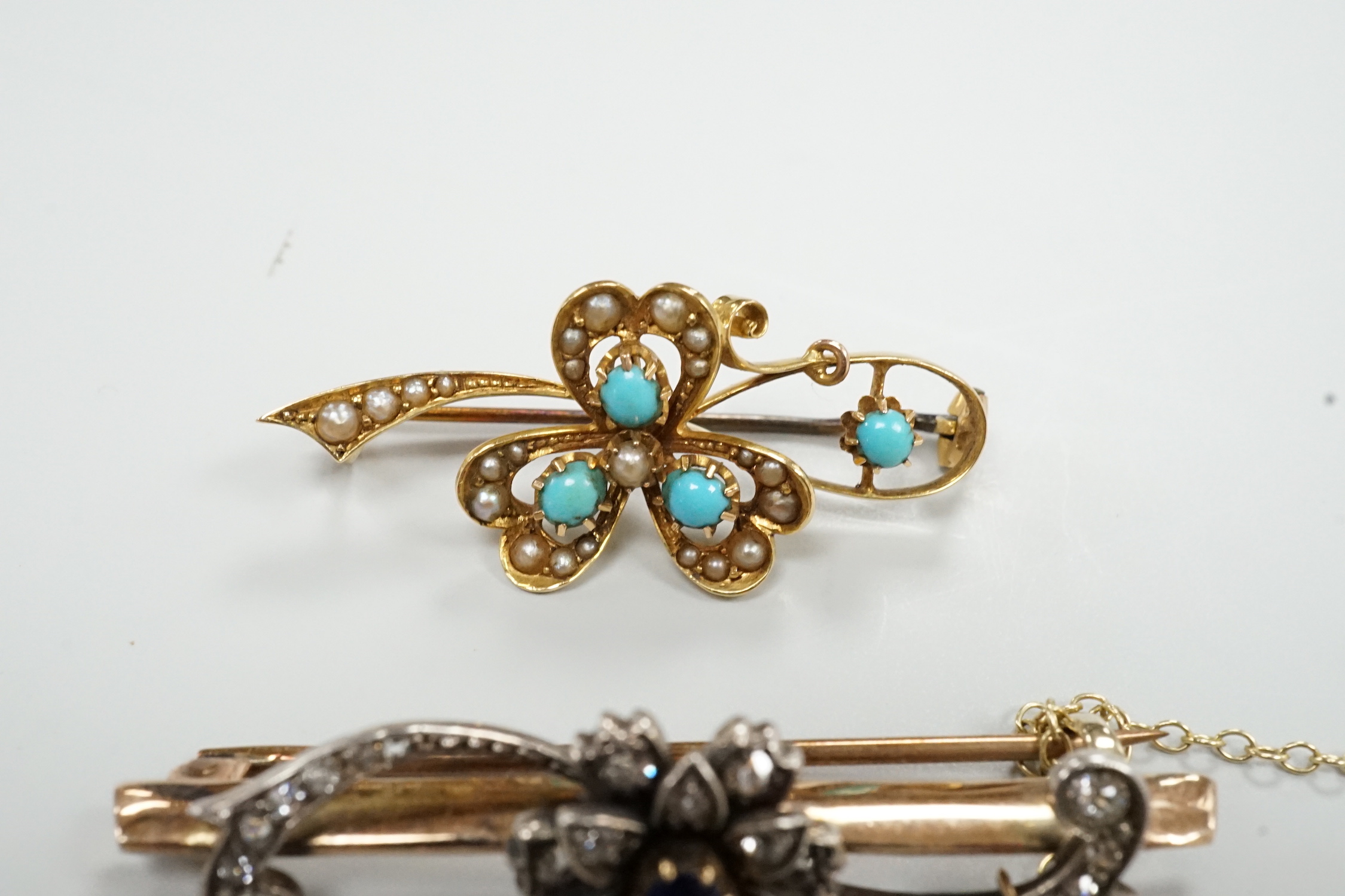 Two late Victorian yellow metal and gem set bar brooches, including sapphire and diamond, 46mm and turquoise and seed pearl, gross weight 9 grams.